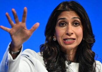 (FILES) Britain’s Home Secretary Suella Braverman addresses delegates at the annual Conservative Party Conference in Manchester, northern England, on October 3, 2023. – British leader Rishi Sunak sacked controversial interior minister Suella Braverman on November 13, 2023, multiple UK media outlets reported, as he reshuffles his top team ahead of a general election expected next year. (Photo by Oli SCARFF / AFP)