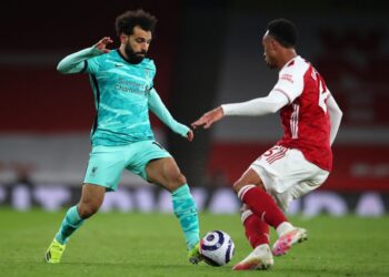 [FILE] Liverpool’s Egyptian midfielder Mohamed Salah (L) runs with the ball as Arsenal’s Brazilian defender Gabriel closes in during the English Premier League football match between Arsenal and Liverpool at the Emirates Stadium in London. (Photo by Catherine Ivill / POOL / AFP)