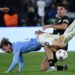 Celtic’s Danish midfielder #33 Matthew O’Riley fights for the ball with Lazio’s Italian midfielder #65 Nicolo Rovella during the UEFA Champions League Group E football match between Lazio and Celtic Glasgow at the Olympic stadium in Rome on November 28, 2023. (Photo by Filippo MONTEFORTE / AFP)