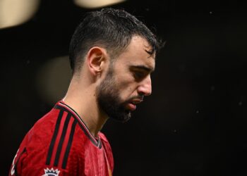 Manchester United’s Portuguese midfielder #08 Bruno Fernandes reacts to their defeat on the pitch after the English Premier League football match between Manchester United and Bournemouth at Old Trafford in Manchester, north west England, on December 9, 2023. – Bournemouth won the game 3-0. (Photo by Oli SCARFF / AFP)