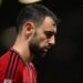 Manchester United’s Portuguese midfielder #08 Bruno Fernandes reacts to their defeat on the pitch after the English Premier League football match between Manchester United and Bournemouth at Old Trafford in Manchester, north west England, on December 9, 2023. – Bournemouth won the game 3-0. (Photo by Oli SCARFF / AFP)