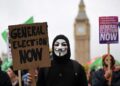 (FILES) Demonstrators with placards calling for a General Election march near the Houses of Parliament in central London, during a a national demonstration on November 5, 2022, calling for a General Election. – British Prime Minister Rishi Sunak is expected to call a general election at some point in 2024 but exactly when is becoming a source of increasingly fevered speculation among political observers. The maximum term of a UK parliament is five years. The last nationwide vote took place on December 12, 2019. The next election has to happen by January 28, 2025, five years since the current parliament first met and after allowing time for campaigning. (Photo by JUSTIN TALLIS / AFP)