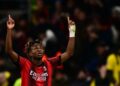 AC Milan’s Nigerian midfielder Samuel Chukwueze celebrates after scoring the team’s first goal during the UEFA Champions League Group F football match between AC Milan and Borussia Dortmund at the San Siro stadium in Milan on November 28, 2023. (Photo by AFP)