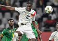 Guinea’s midfielder #10 Moriba Kourouma (C) heads the ball during the Africa Cup of Nations (CAN) 2024 group C football match between Cameroon and Guinea at Stade Charles Konan Banny in Yamoussoukro on January 15, 2024. (Photo by Issouf SANOGO / AFP)