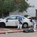 Israeli police forensics personnel inspect a damaged car following a suspected ramming attack in the central town of Raanana, on January 15, 2024. (Photo by JACK GUEZ / AFP)