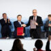 Swiss Federal Minister Guy Parmelin (Front R), and Wang Shouwen, Chinese Vice Minister of the Ministry of Commerce, shake hands after signing a joint statement of the free trade agreement as Swiss President Viola Amherd (Back-R), and Chinese Prime Minister Li Qiang (Back L) applaude, during an official visit to Kehrsatz, near Switzerland’s administrative capital Bern on January 15, 2024. – Li Qiang, is visiting Switzerland to attend the 54th World Economic Forum Annual (WEF) which is taking place from January 14-19 in Davos. (Photo by PETER KLAUNZER / POOL / AFP)