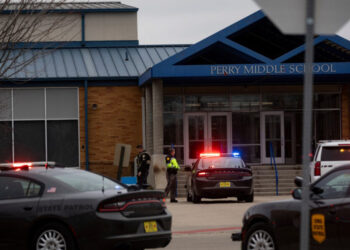 Police officers secure the campus at Perry Middle and High School during a shooting situation in Perry, Iowa, on January 4, 2024. – A shooting on Thursday at the high school in Perry left “multiple gunshot victims,” local authorities said, adding the incident was over but without confirming if anyone had been killed. (Photo by Christian Monterrosa / AFP)