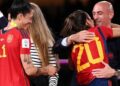 (FILES) Spain’s defender #20 Rocio Galvez is congratulated by President of the Royal Spanish Football Federation Luis Rubiales (R) next to Spain’s Jennifer Hermoso after winning the Australia and New Zealand 2023 Women’s World Cup final football match between Spain and England at Stadium Australia in Sydney on August 20, 2023. – A Spanish judge on January 25, 2024 proposed that disgraced former Spanish football chief Luis Rubiales be tried over the kiss he forced on World Cup star Jenni Hermoso. (Photo by FRANCK FIFE / AFP)