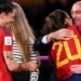 (FILES) Spain’s defender #20 Rocio Galvez is congratulated by President of the Royal Spanish Football Federation Luis Rubiales (R) next to Spain’s Jennifer Hermoso after winning the Australia and New Zealand 2023 Women’s World Cup final football match between Spain and England at Stadium Australia in Sydney on August 20, 2023. – A Spanish judge on January 25, 2024 proposed that disgraced former Spanish football chief Luis Rubiales be tried over the kiss he forced on World Cup star Jenni Hermoso. (Photo by FRANCK FIFE / AFP)