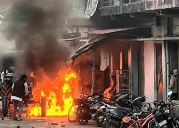 Smoke billows at scene of demolition in madrassa after a buldozer pulled down Islamic structures. Photo:Daily Sun