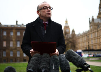 Britain's Northern Ireland Secretary Chris Heaton-Harris speaks to the press on College Green in London on January 30, 2024. - Northern Ireland's main pro-UK party, the DUP, said it endorses a deal with the UK government allowing it to end a long-running boycott of the province's devolved administration. The DUP walked out of the regional government in February 2022 in protest against post-Brexit trade arrangements for Northern Ireland, the only region of the UK to have a land border with the European Union. (Photo by HENRY NICHOLLS / AFP)