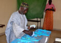 A man casts his vote on September 1, 2018 at the polling station in Nouakchott for the country's legislative, regional and local elections. - Mauritania, a frontline state in the  fight against Islamic extremism, voted on September 1 in legislative, regional and local elections that will test head of state Mohamed Ould Abdel Aziz's record seven months before a presidential vote. Military personnel cast their ballots Friday to free themselves up to provide security in the vast and arid west African state with a registered electorate of some 1.4 million. (Photo by AHMED OULD MOHAMED OULD ELHADJ / AFP)        (Photo credit should read AHMED OULD MOHAMED OULD ELHADJ/AFP/Getty Images)