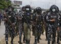 Police officers patrol during a protest against the economic hardship. on the street in Lagos, Nigeria, Friday, Aug 2, 2024.