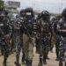 Police officers patrol during a protest against the economic hardship. on the street in Lagos, Nigeria, Friday, Aug 2, 2024.